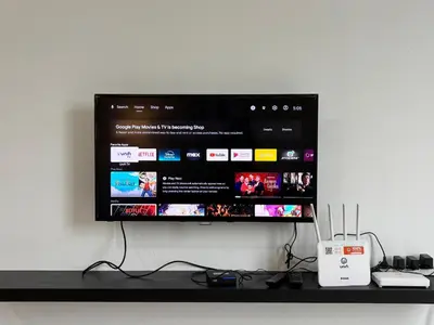 a flat screen tv sitting on top of a shelf at JS Comfortable Stay Golden Hills Pasar Malam Studio in Brinchang
