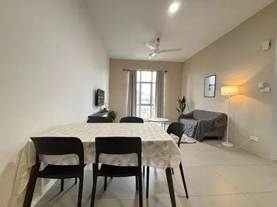 a dining room with a table and chairs at JS Comfortable Stay Golden Hills Pasar Malam Studio in Brinchang