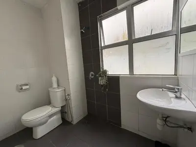 a bathroom with a toilet and a sink and a window at JS Comfortable Stay Golden Hills Pasar Malam Studio in Brinchang