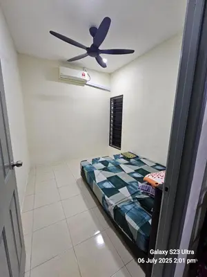a bedroom with a bed and a ceiling fan at Homestay ZAF sitiawan in Sitiawan