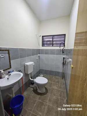 a bathroom with a toilet and a sink at Homestay ZAF sitiawan in Sitiawan