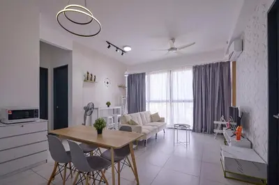 a kitchen and living room with a table and chairs at Seaview Infinity Pool 3BR 8Pax 2Carpark 211 in George Town