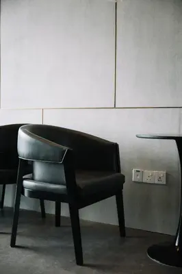 a black chair sitting in a waiting room at Seaview Infinity Pool 3BR 8Pax 2Carpark 211 in George Town