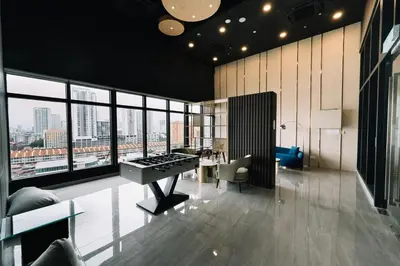 an office with a piano and a desk in a room with windows at Seaview Infinity Pool 3BR 8Pax 2Carpark 211 in George Town