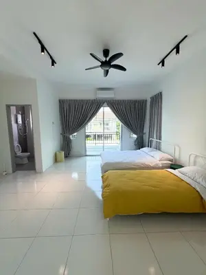 a bedroom with two beds and a ceiling fan at Lake Grove 17 near Tambun 4BR - 8 PAX in Kampong Batu Lapan