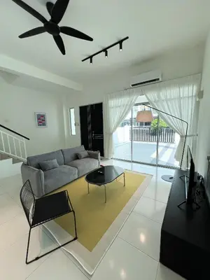 a living room with a couch and a ceiling fan at Lake Grove 17 near Tambun 4BR - 8 PAX in Kampong Batu Lapan
