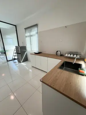 a kitchen with a sink and a counter top at Lake Grove 17 near Tambun 4BR - 8 PAX in Kampong Batu Lapan