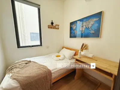 a small bedroom with a bed and a window at StarviewBay Forest City 2B1R Cozy Condo in Gua Sai