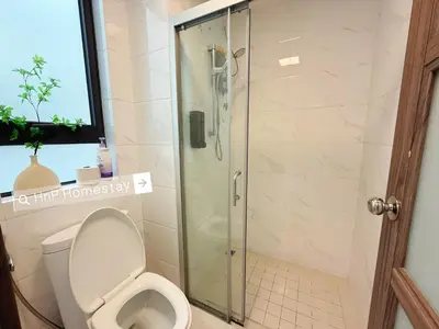 a bathroom with a shower with a toilet at StarviewBay Forest City 2B1R Cozy Condo in Gua Sai