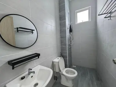 a white bathroom with a mirror and a sink at Padang Serai Wangi Roomstay 95 in Padang Serai