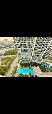 an overhead view of a building with a swimming pool at Cybersquare Vertex Tower in Gua Sai