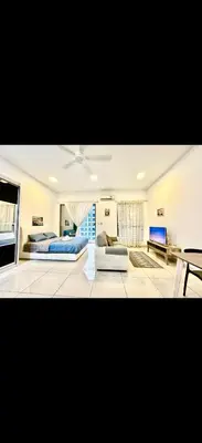 a large living room with two beds and a couch at Cybersquare Vertex Tower in Gua Sai