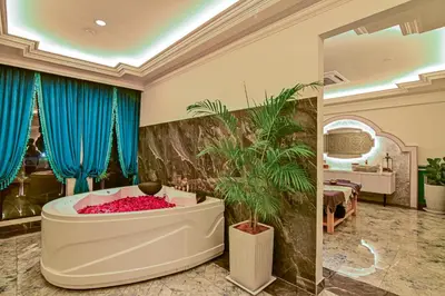 a large bathroom with a tub in a room at Bertam Wellness Spa & Villas - A Member of Small Luxury Hotels of the World in Kepala Batas