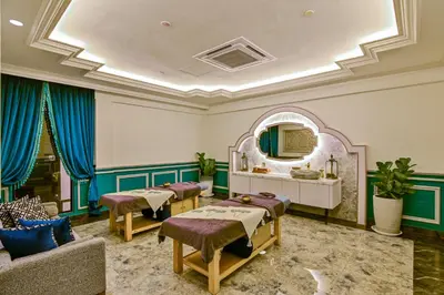 a salon with a waiting room with beds and a mirror at Bertam Wellness Spa & Villas - A Member of Small Luxury Hotels of the World in Kepala Batas