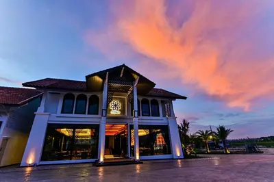 a building with a clock on the front of it at Bertam Wellness Spa & Villas - A Member of Small Luxury Hotels of the World in Kepala Batas
