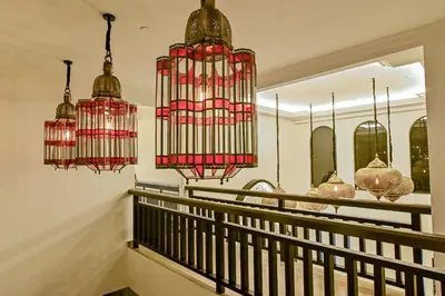 two chandeliers hanging above a staircase in a house at Bertam Wellness Spa & Villas - A Member of Small Luxury Hotels of the World in Kepala Batas