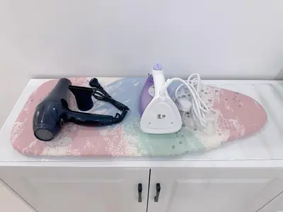 a snowboard sitting on top of a counter with a hair dryer at BM Alma AutoCity Aeonjusco in Bukit Mertajam
