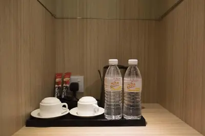 two bottles of water are sitting on a shelf at Mornington Hotel Waterfront Lumut in Lumut