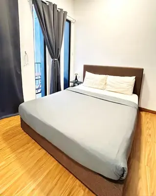 a bedroom with a white bed with a window at Beacon #2BR FamilyStay #22Georgetown in George Town