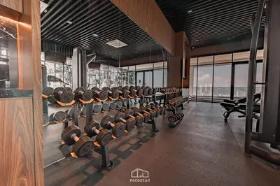 a gym with rows of dumbbells in a room at Beacon #2BR FamilyStay #22Georgetown in George Town