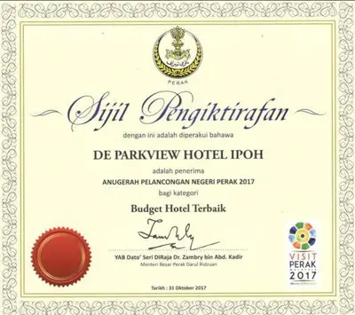 a invitation to a hotel hotel room with a certificate at De Parkview Hotel in Ipoh