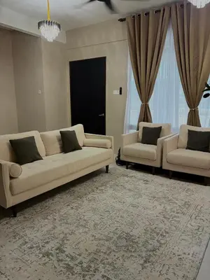 a living room with two couches and two windows at Homestay Taman Scientex Kota Tinggi in Gua Sai