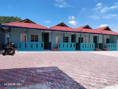 a building with a motorcycle parked in front of it at SkyView Village Ulu Chemor in Chemor