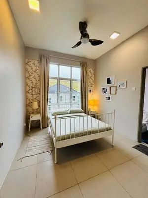 a bedroom with a bed and a ceiling fan at Kareena Barrington Square Goldenhills Pasar Malam Cameron Highlands in Brinchang