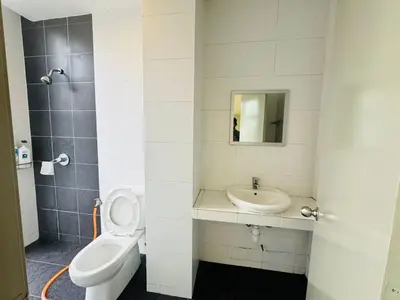 a bathroom with a toilet and a sink at Kareena Barrington Square Goldenhills Pasar Malam Cameron Highlands in Brinchang
