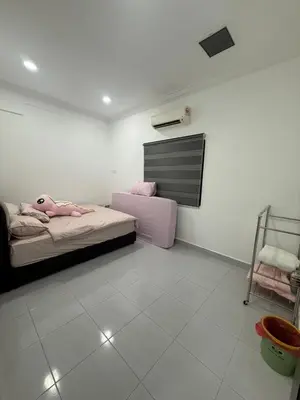 a bedroom with a bed with a doll on it at Happy Guest House Taman Cowin Nibong Tebal \u5f00\u5fc3\u6c11\u5bbfTaman Cowin\u9ad8\u6e0a\u533a in Nibung Tebal
