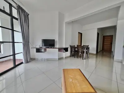 a living room with a couch and a table at Marina Teluk Batik by Manhattan Group in Lumut