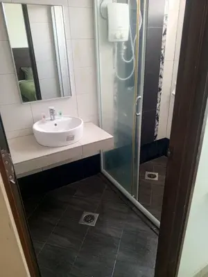 a bathroom with a sink and a shower at Marina sunset view in Lumut