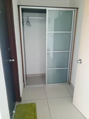 a shower with a glass door in a bathroom at Marina sunset view in Lumut