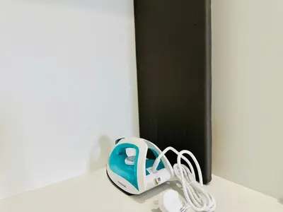 a blue and white helmet sitting on a counter at CozyStay Rooftop Sky Pool Sea &Bridge View Luxury 9pax in Bayan Lepas