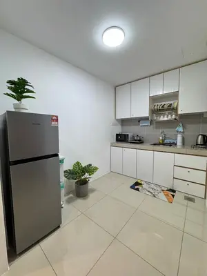 a kitchen with a refrigerator and a tile floor at Manhattan Condominium Ipoh' Rachel in Ipoh