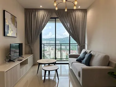 a living room with a couch and a large window at New LuxurySuite Rooftop Pool Stunning View airport 9pax in Bayan Lepas