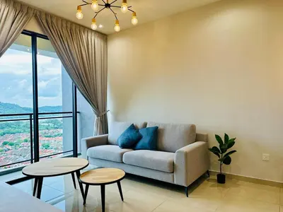 a living room with a couch and two tables at New LuxurySuite Rooftop Pool Stunning View airport 9pax in Bayan Lepas