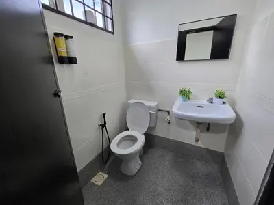 a bathroom with a toilet and a sink at Blue House Kampar 3BR Family Suite-Kids Playroom Near UTAR in Kampar