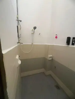 a bathroom with a shower with a shower at Homestay Dmickey in Sungai Petani