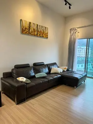 a black leather couch in a living room with a window at AYAAN Nova PingPong House Free Parking in Tanah Rata