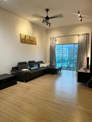 a living room with a black couch and a ceiling fan at AYAAN Nova PingPong House Free Parking in Tanah Rata