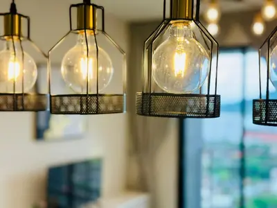 a group of lights hanging from a wall at Explore Penang Stay Style w Sky pool Sea airport 9pax in Bayan Lepas