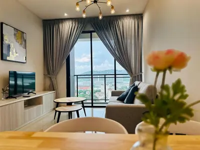 a living room with a couch and a large window at Sky Pool Luxury Sea View Near Penang Airport 9pax in Bayan Lepas