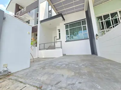an open garage with a white garage door at Shamrock Beach Villas - Batu Ferringhi in Tanjung Bungah