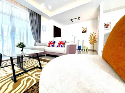 a living room with a couch and a table at Gioia Home Two Taiping Town in Taiping