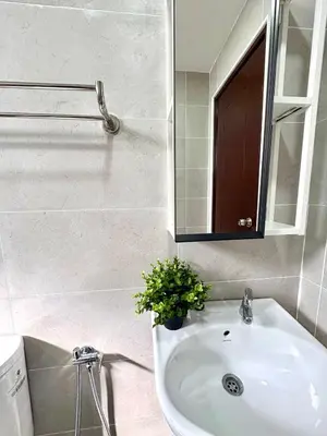 a bathroom with a sink and a mirror at Gioia Home Two Taiping Town in Taiping