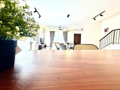 a large room with a table with plants on it at Gioia Home Two Taiping Town in Taiping