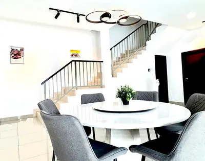 a white dining room with a white table and chairs at Gioia Home Two Taiping Town in Taiping