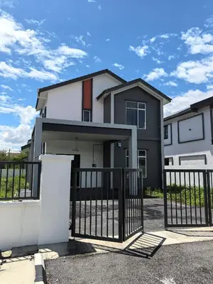 a house with a gate in front of it at Padang Serai Wangi Roomstay 91 in Padang Serai