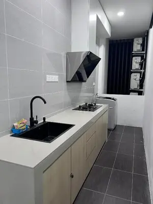 a kitchen with a sink and a toilet at Kuching Town Area Rex apartment in Gua Sai